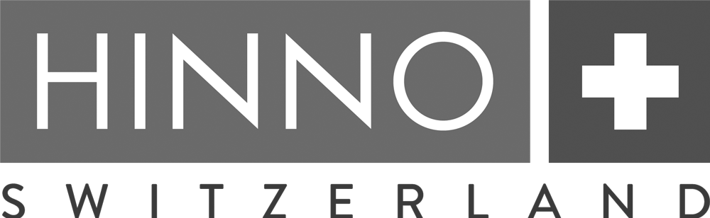 Logo von HINNO Switzerland, einem Unternehmen, das sich auf hochwertige Produkte spezialisiert hat. Das Logo besteht aus dem Firmennamen "HINNO" in blauer Schrift und einem stilisierten Pluszeichen in schwarzer Farbe.